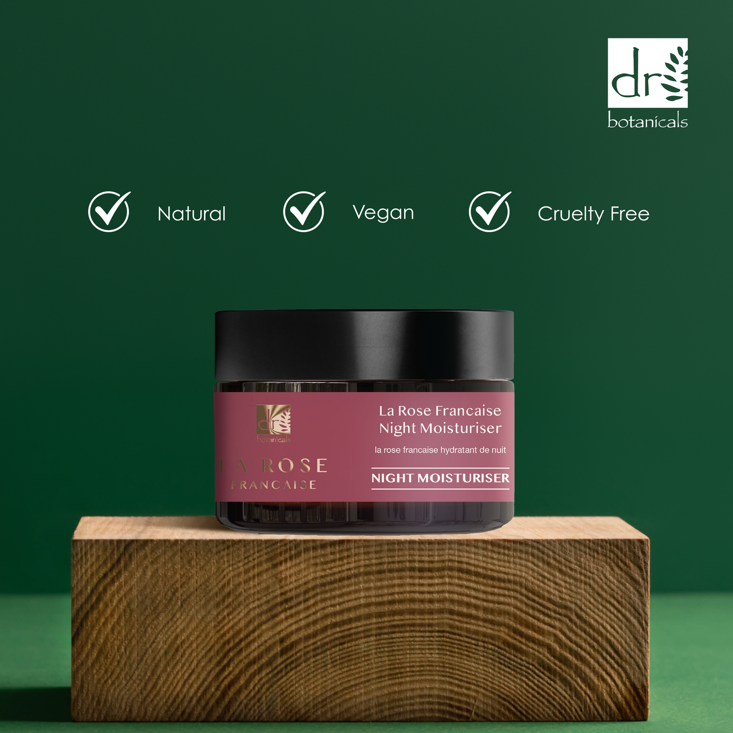 Jar of 'La Rose Française Night Moisturiser' on a wooden block with green background and Dr Botanicals logo.