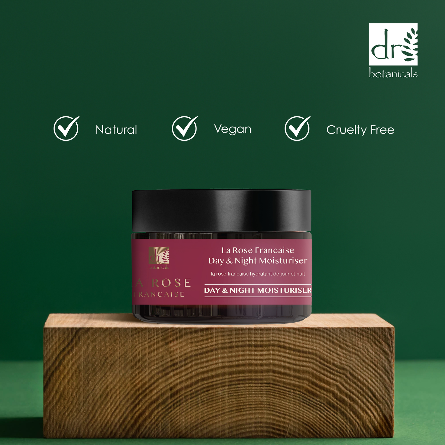 Day & Night Moisturizer jar on a wooden block with green background and Dr Botanicals logo.