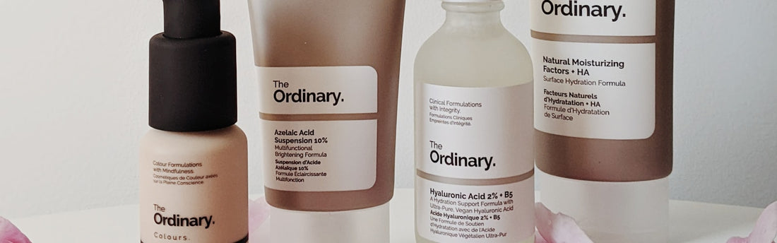 Skincare products arranged flat, used to illustrate a simple skincare routine