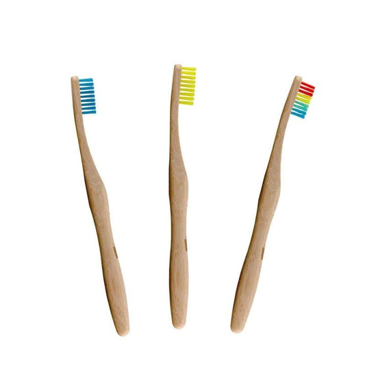 Three bamboo toothbrushes with colourful bristles on a white background