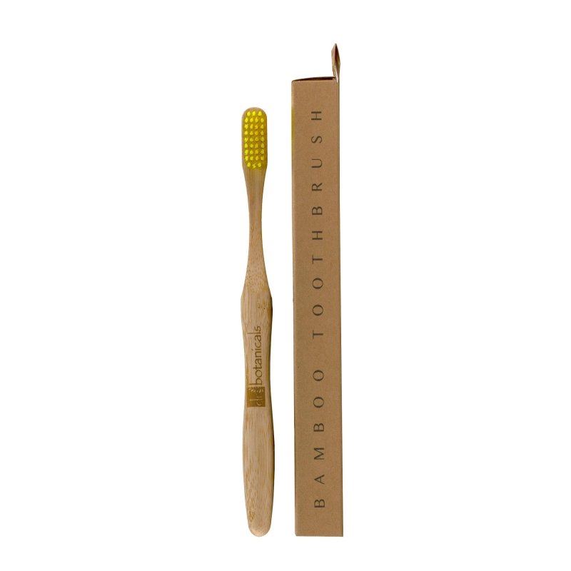 Bamboo toothbrush with yellow bristles and packaging on a white background