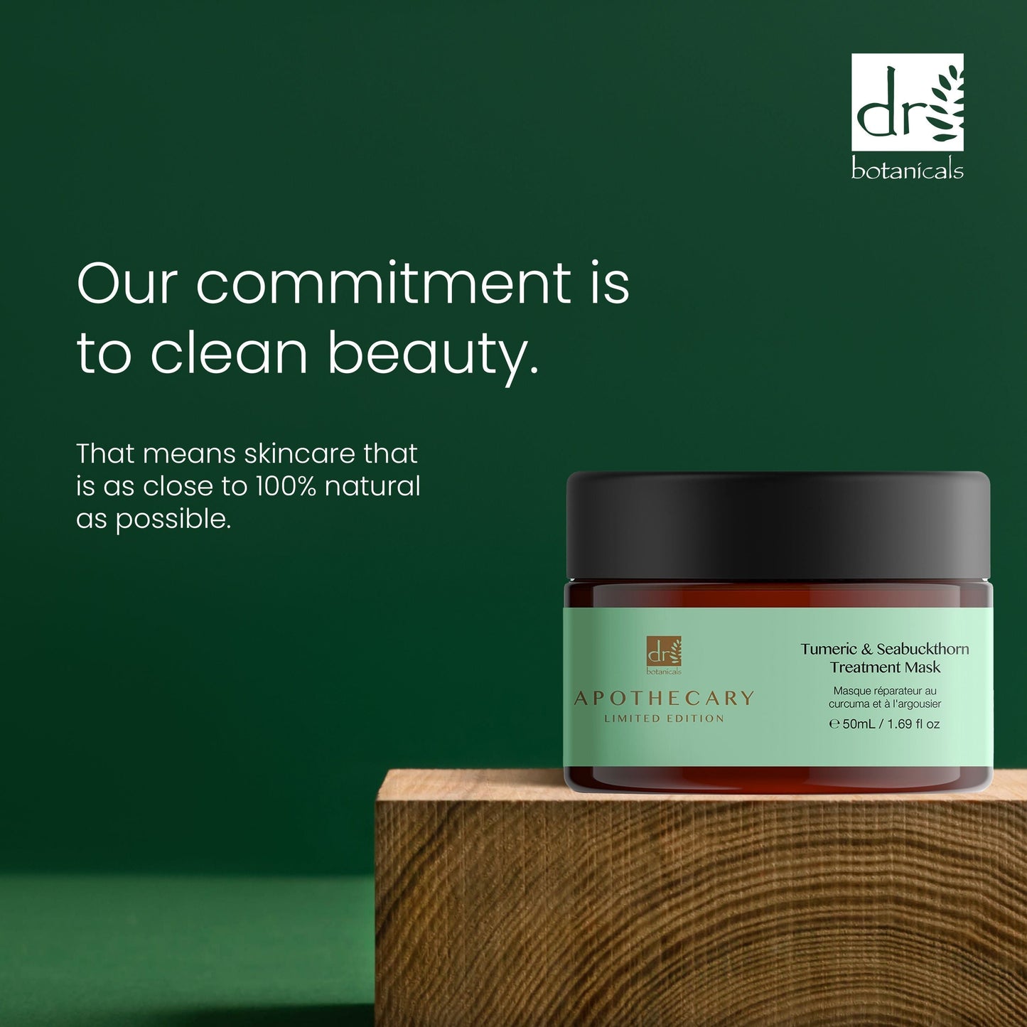Skincare jar with green label on wooden block against a green background, featuring Dr Botanicals branding.