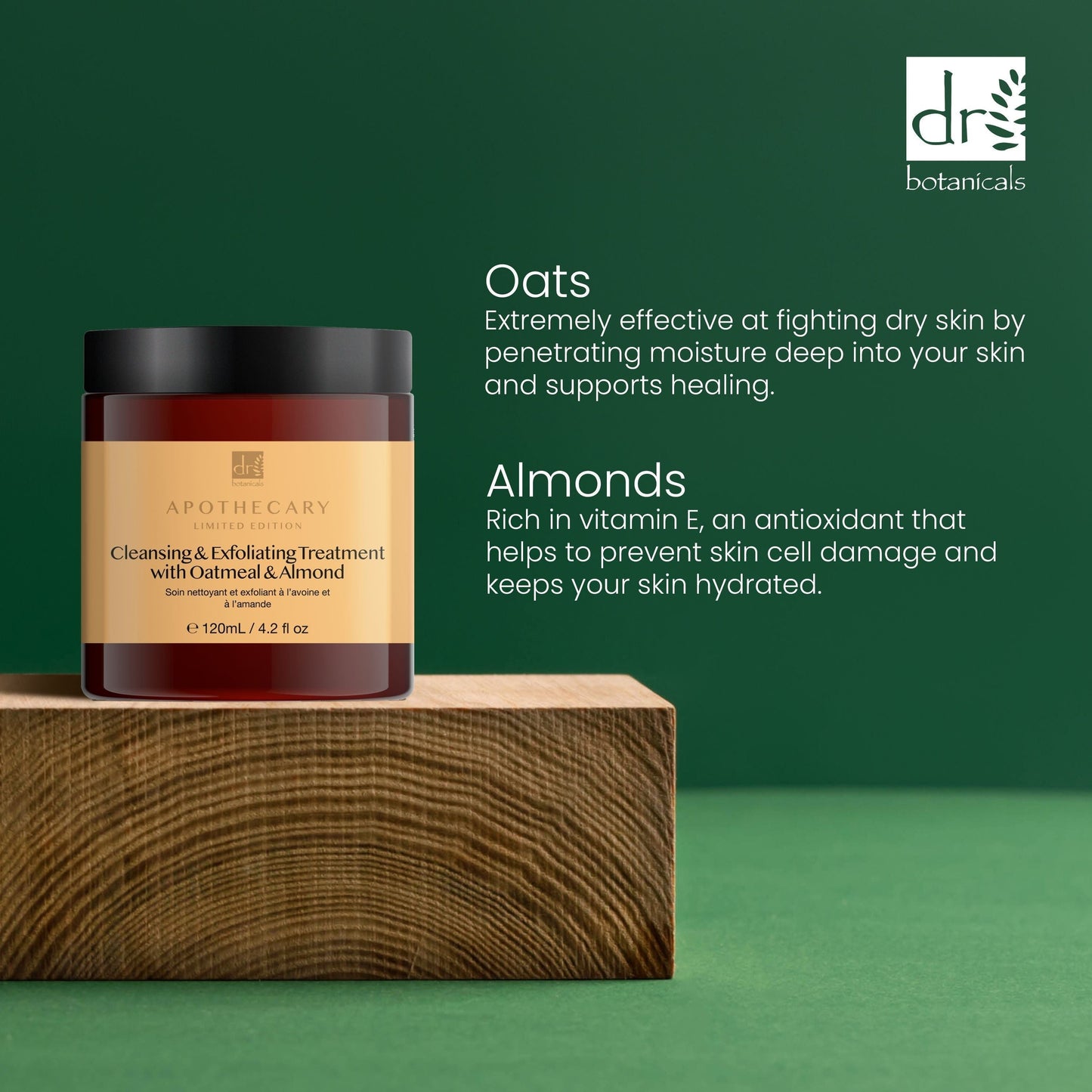 Jar of cleansing and exfoliating treatment with oats and almonds on a wooden block against a green background.