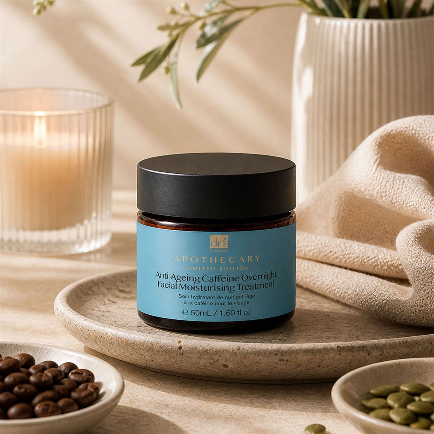 skinChemists Anti-Ageing Caffeine Overnight Facial Treatment 50ml on a wooden surface with candles and plants in the background