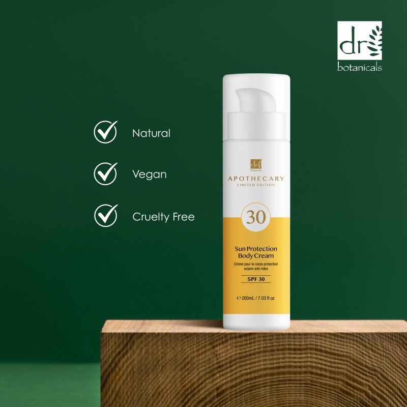 Sun protection body cream bottle with Dr Botanicals branding on a green background