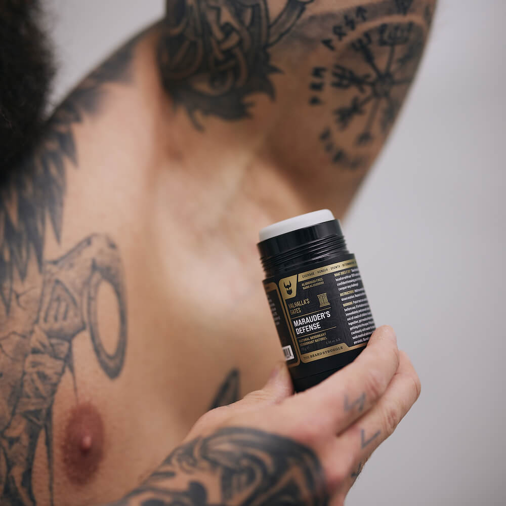 Man applying Marauder's Defense deodorant