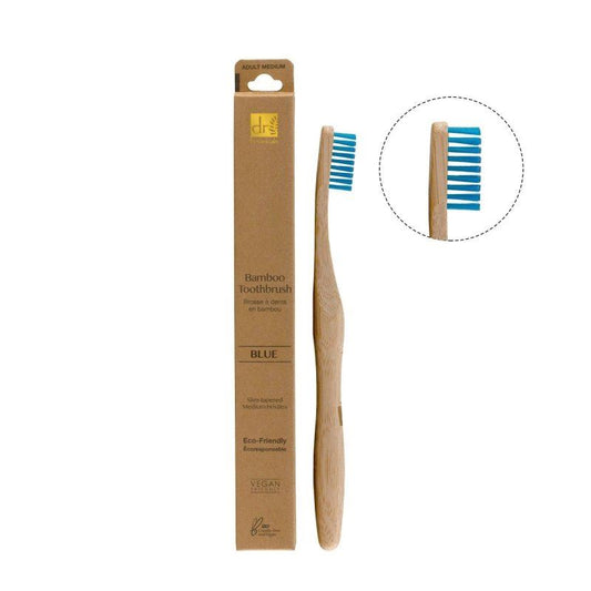 Bamboo toothbrush with blue bristles and packaging on a white background