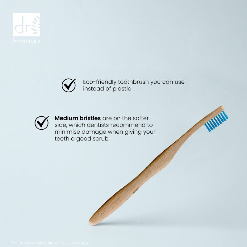 Eco-friendly toothbrush with text on a light blue background