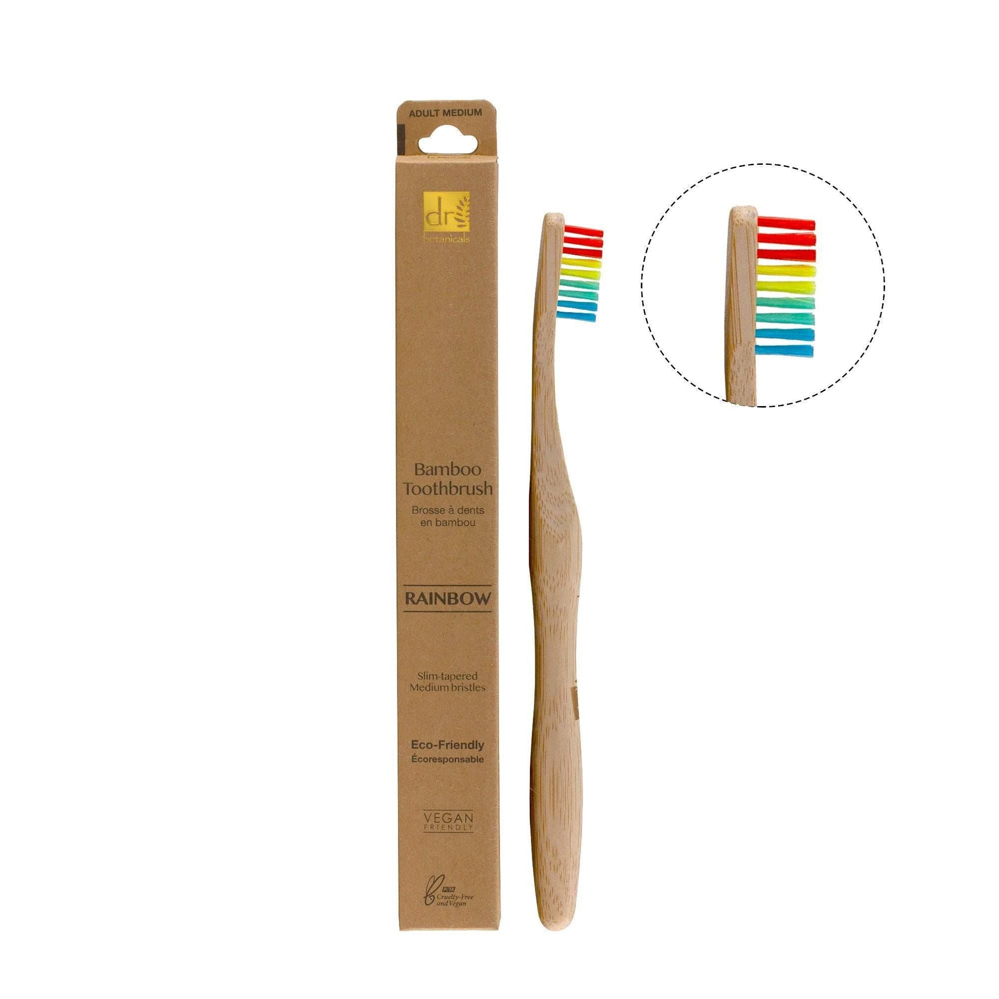 Bamboo toothbrush with rainbow bristles and packaging on a white background