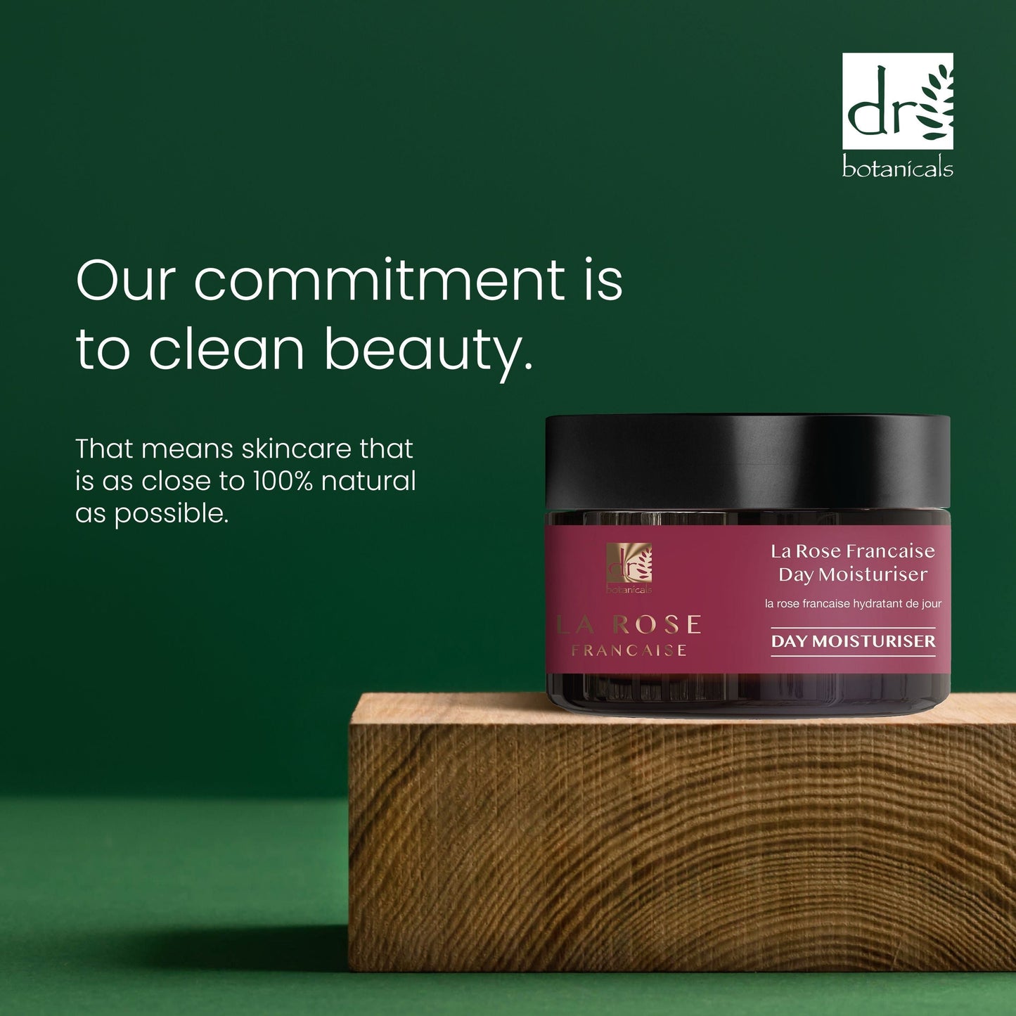 LaRose Française day moisturizer jar on a wooden block with a green background and Dr Botanicals branding.