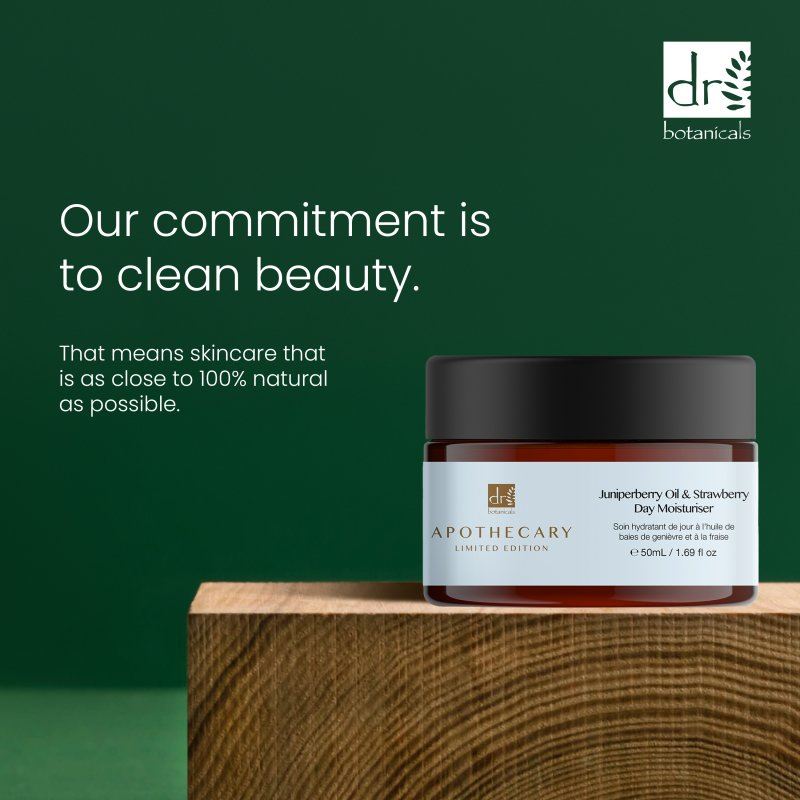 Jar of skincare product on a wooden block with a green background and Dr Botanicals branding.