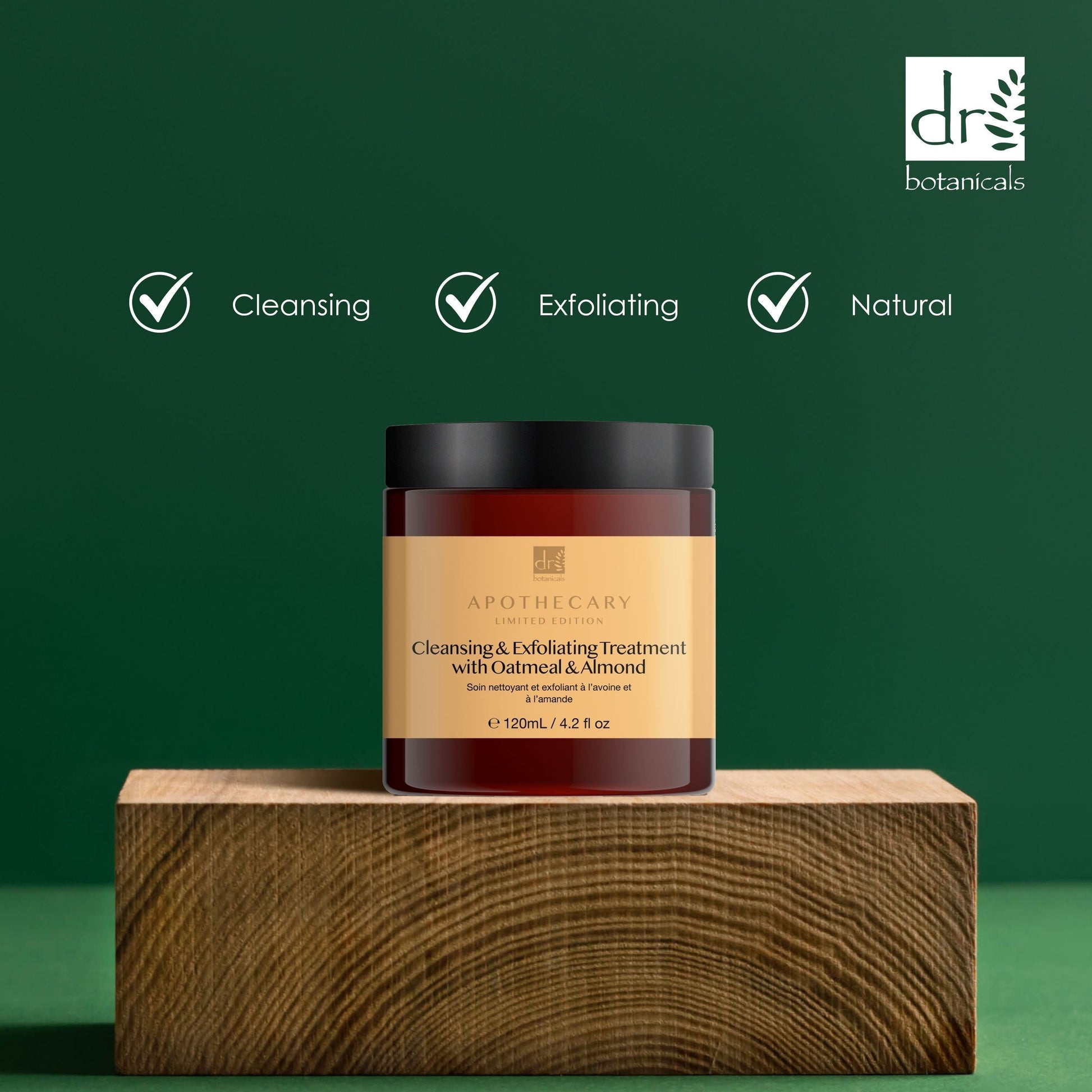 Jar of cleansing and exfoliating treatment on a wooden block with green background and Dr Botanicals logo.
