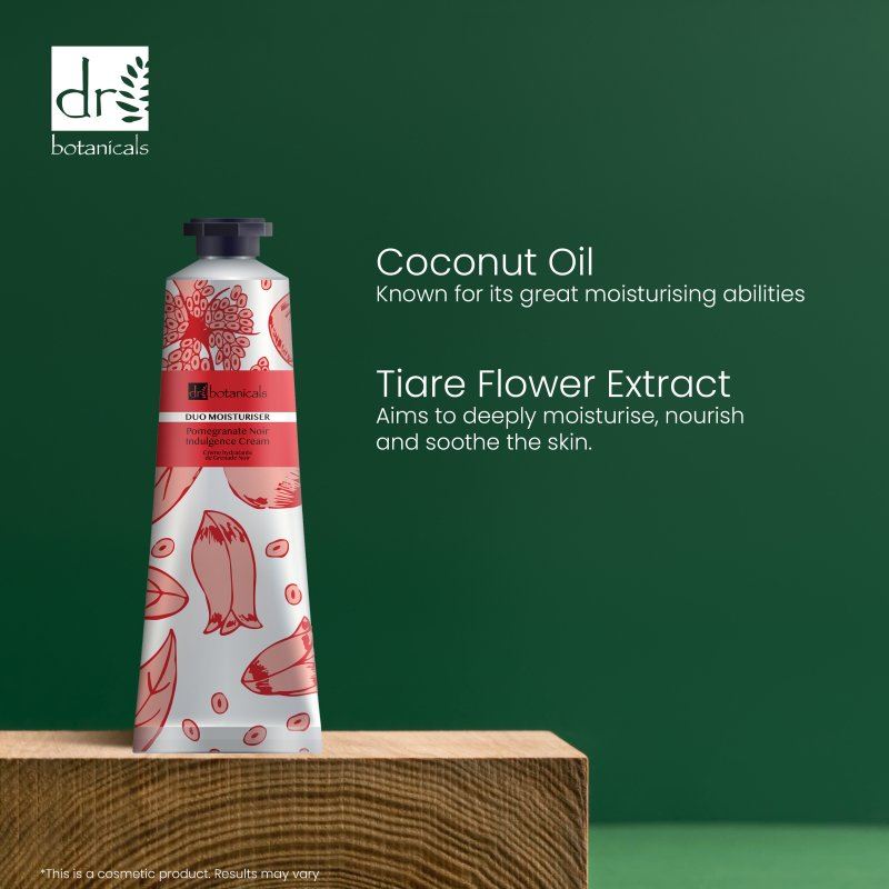 Dr Botanicals Pomegranate Noir Indulgence Cream with coconut oil and tiare flower extract on a green background