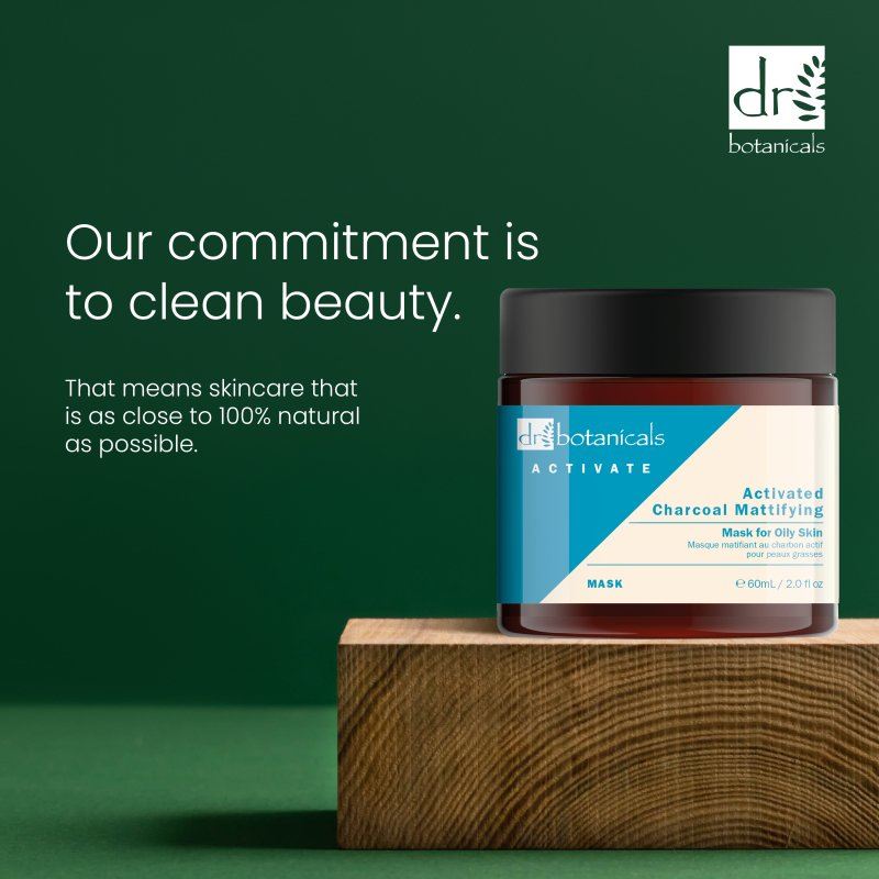Dr Botanicals skincare product on a wooden block with green background and brand logo.