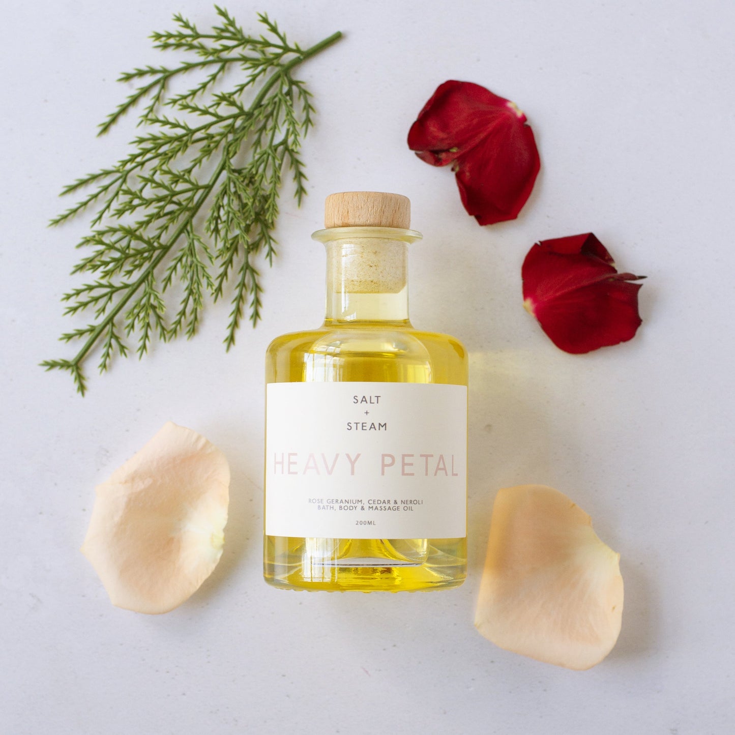 Salt + Steam Heavy Petal bath and body oil bottle