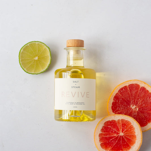 Salt + Steam Revive grapefruit and bergamot bath oil bottle