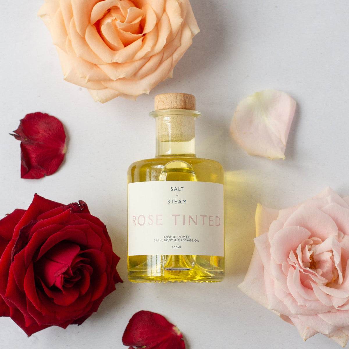 Salt + Steam Rose Tinted bath and body oil bottle