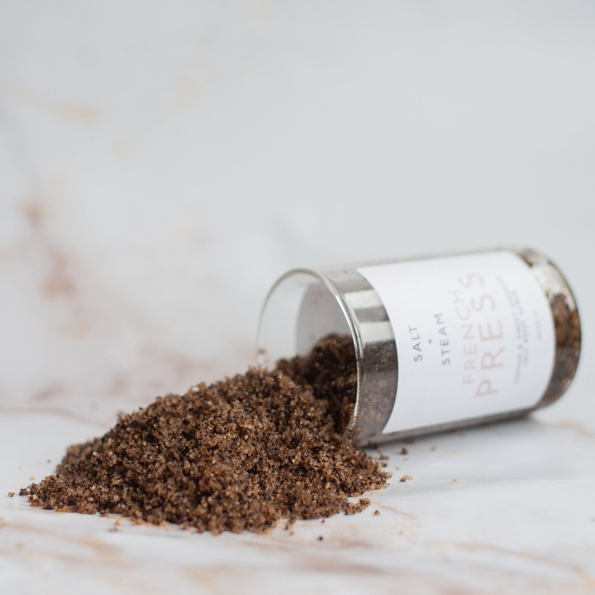 Salt + Steam French Press body scrub being applied to skin