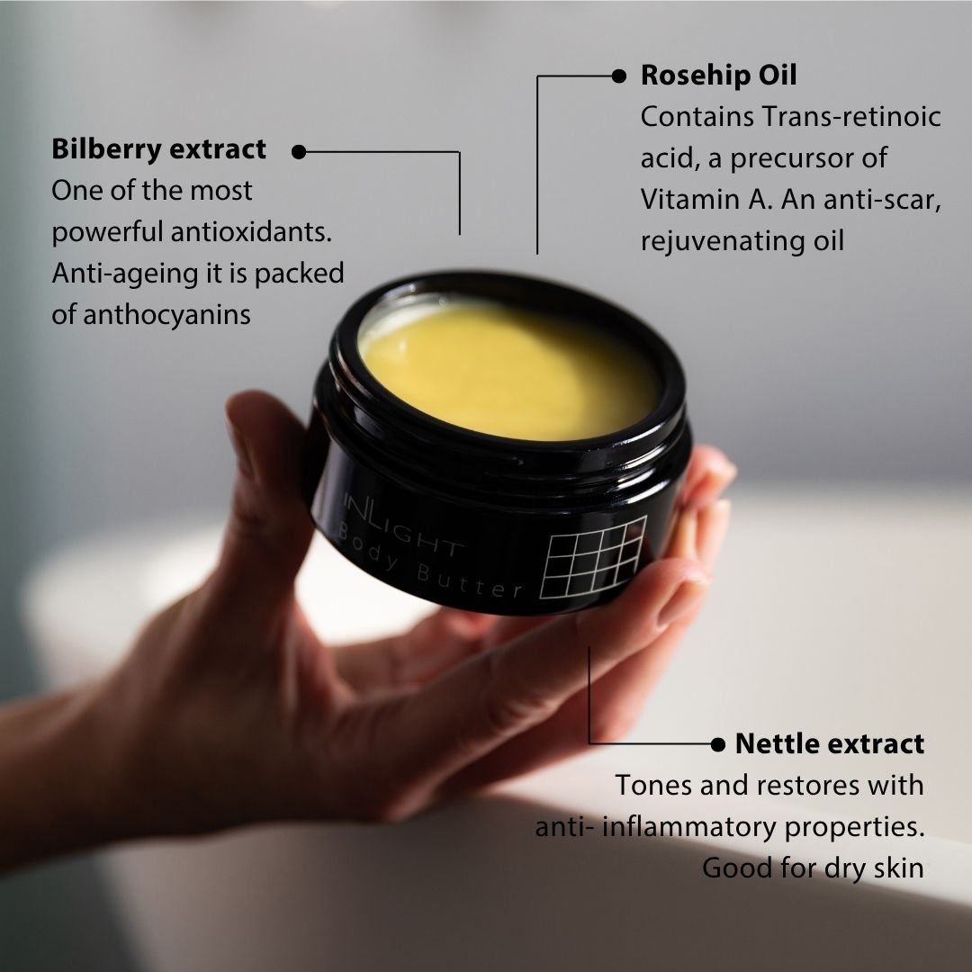 Hand holding a jar of Inlight Beauty Body Butter 90ml with text about ingredients like bilberry extract, rosehip oil, and nettle extract.