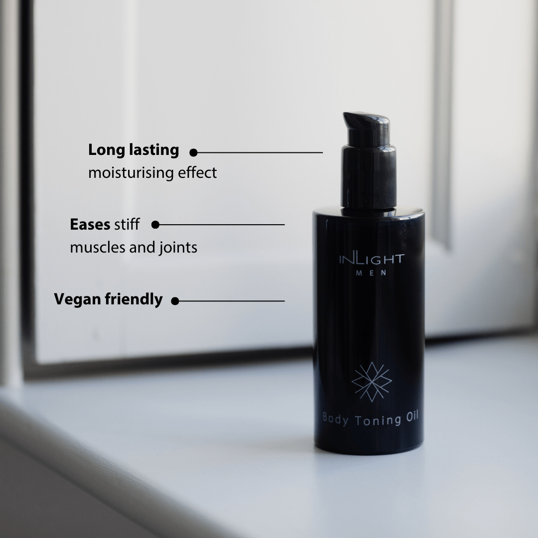 Black bottle of Inlight Beauty Body Toning Oil for Men 200ml on a light surface with text highlighting benefits.