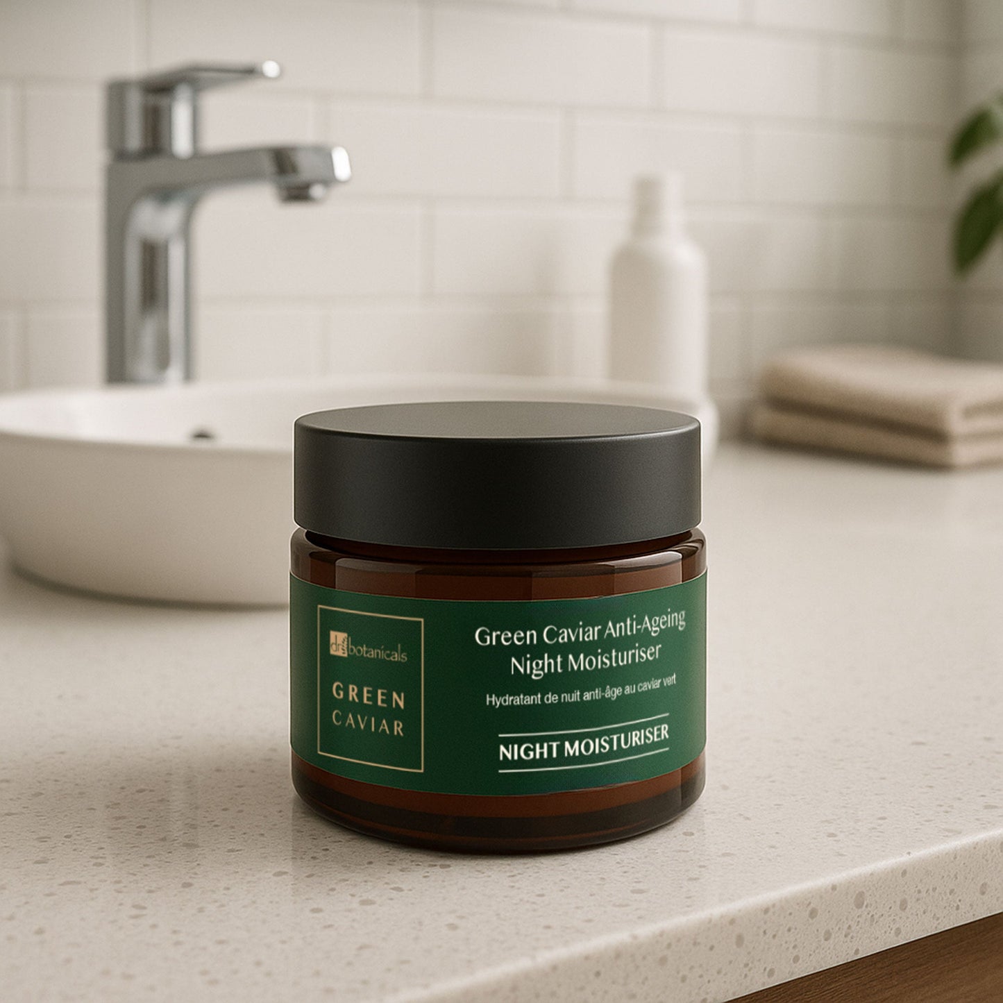 Jar of Green Caviar Anti-Aging Night Moisturizer on a bathroom counter