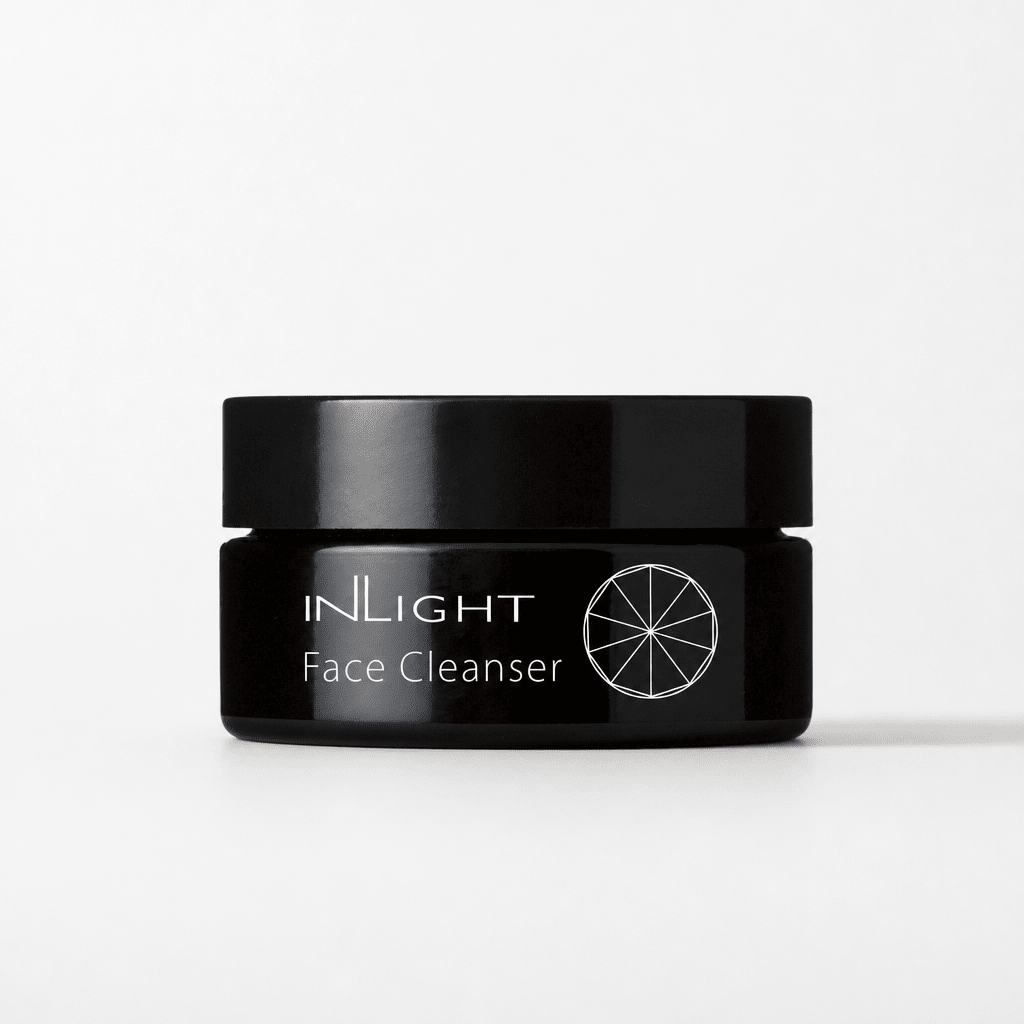 Black jar of Inlight Beauty Face Cleanser on a white background