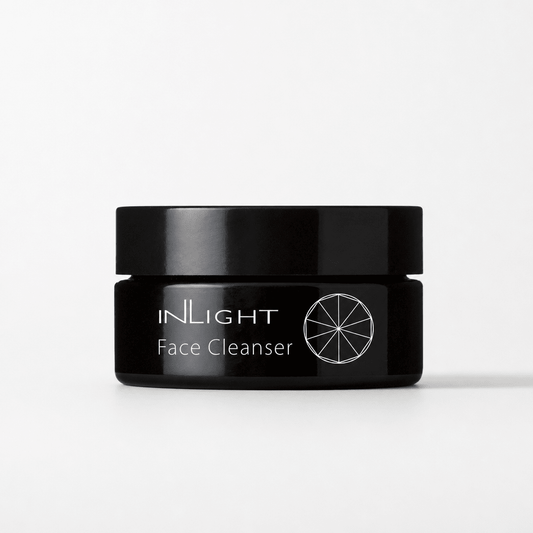 Black jar of Inlight Beauty Face Cleanser on a white background