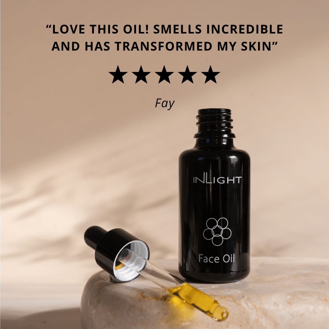 Black face oil bottle with dropper on a beige background, featuring customer review text.