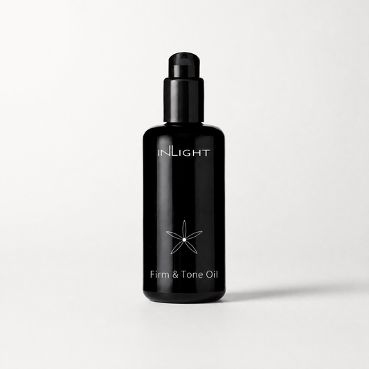Black bottle of Inlight Beauty Firm & Tone Oil 200ml on a white background