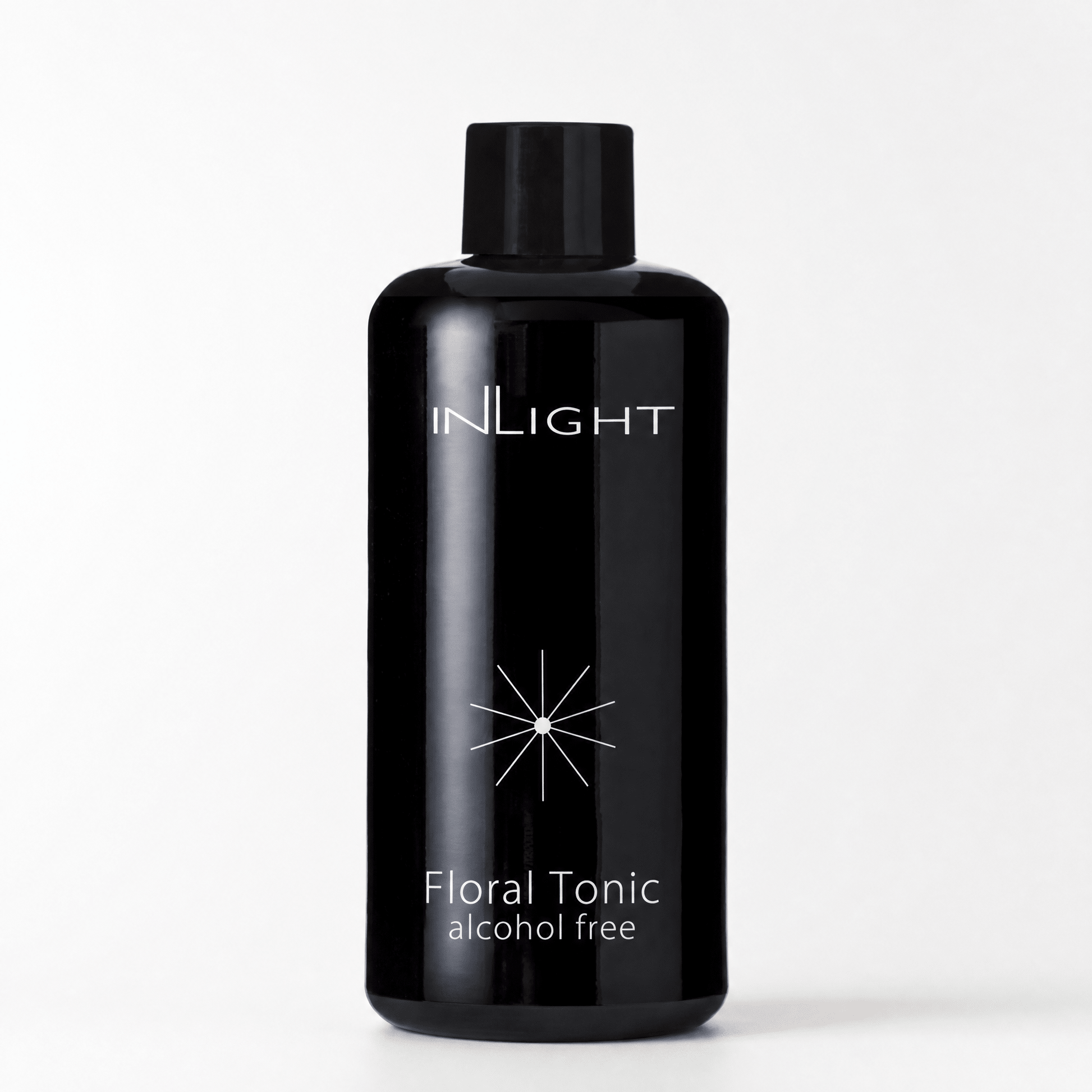 Black bottle of Inlight Beauty Floral Tonic 200ml on a white background