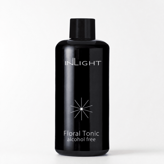 Black bottle of Inlight Beauty Floral Tonic 200ml on a white background
