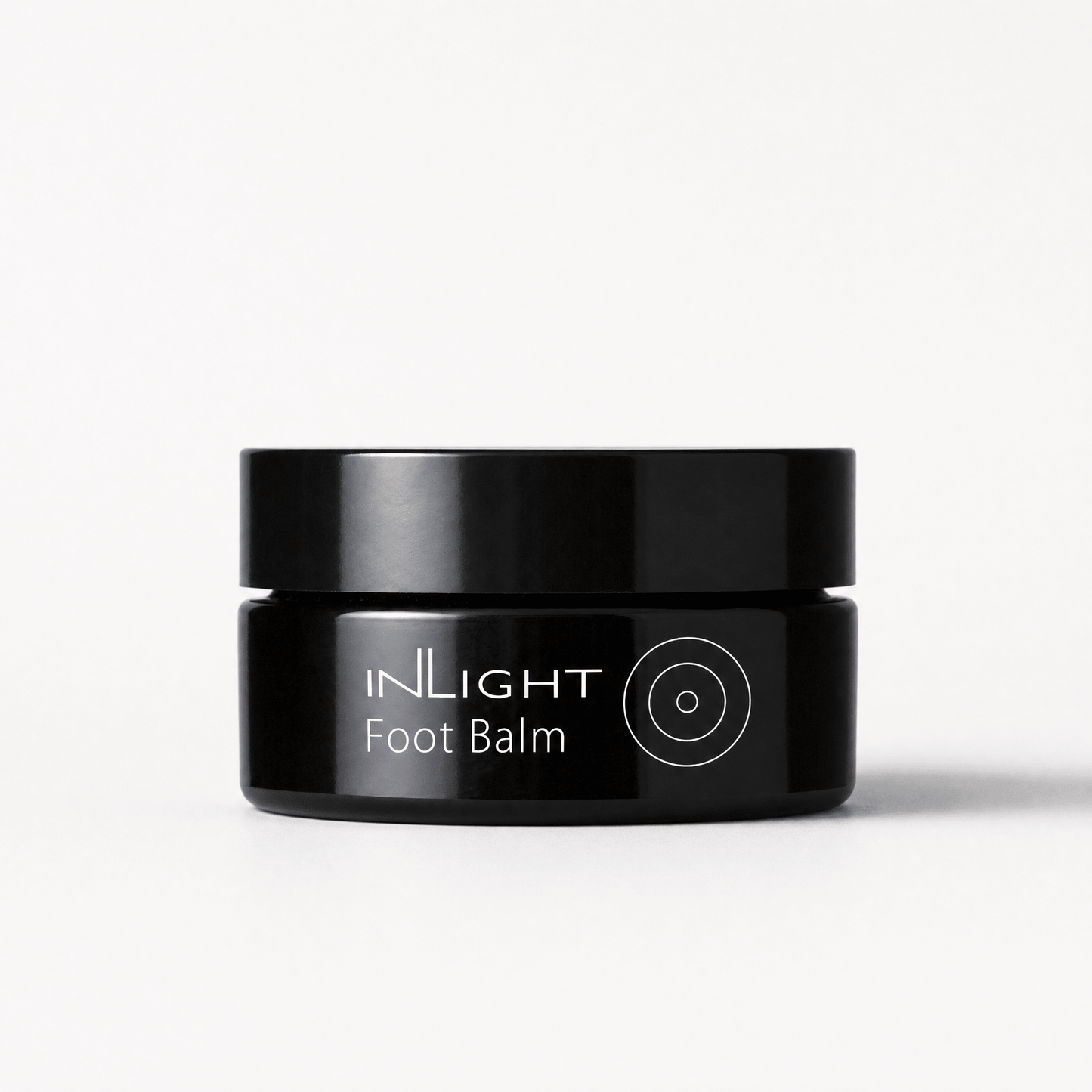 Black jar of Inlight Beauty Foot Balm 45ml on a white background