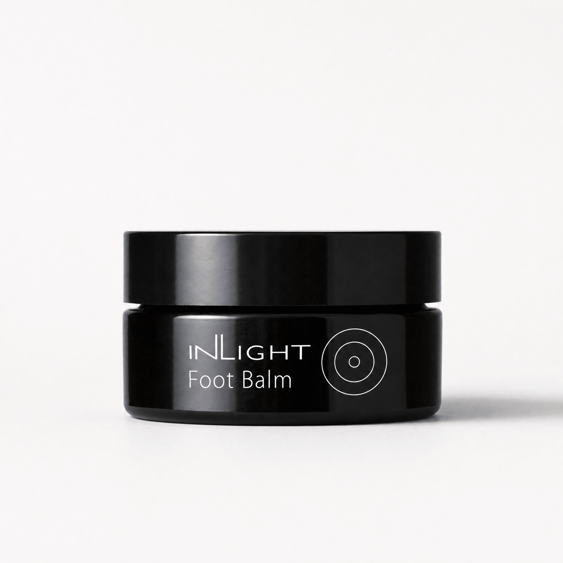 Black jar of Inlight Beauty Foot Balm 45ml on a white background