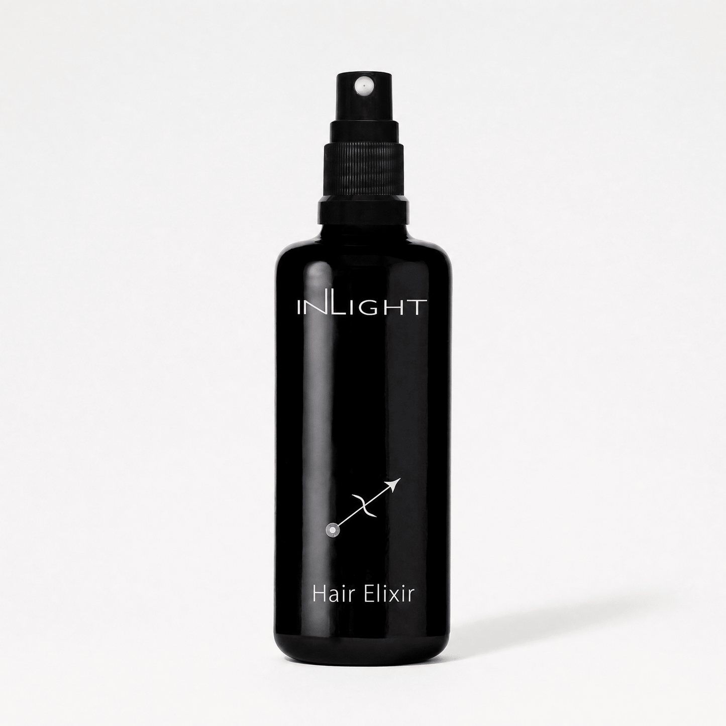 Black bottle of Inlight Beauty Hair Elixir 100ml on a white background
