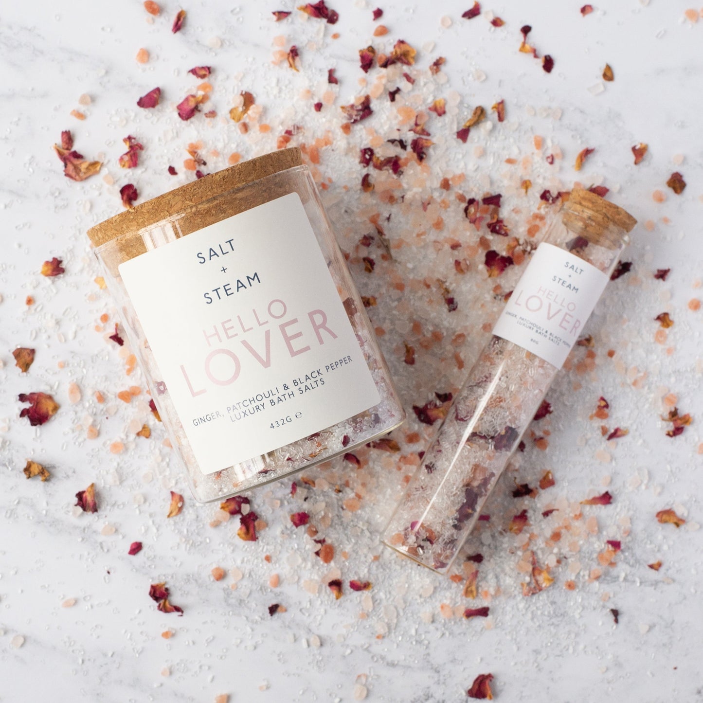 Salt + Steam Hello Lover bath salts being poured into a bath