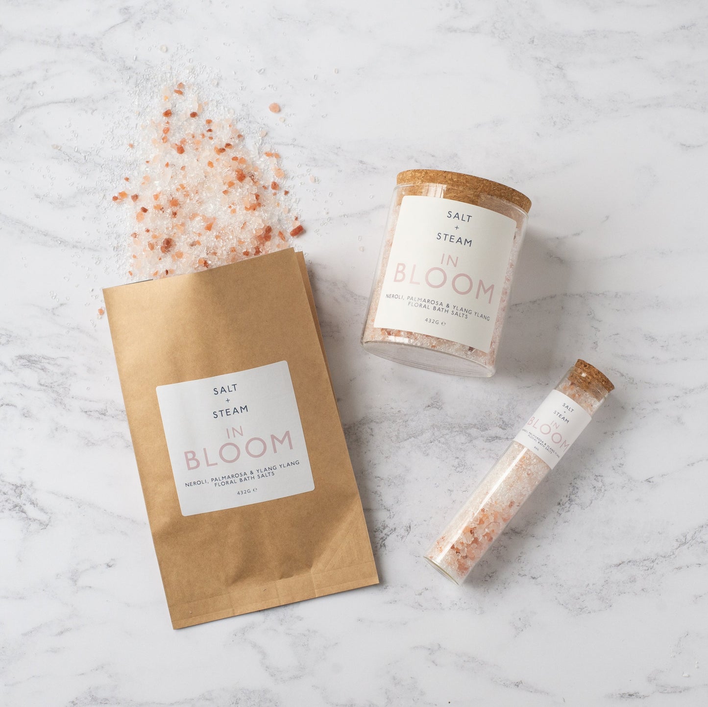 Salt + Steam In Bloom bath salts being poured into a bath