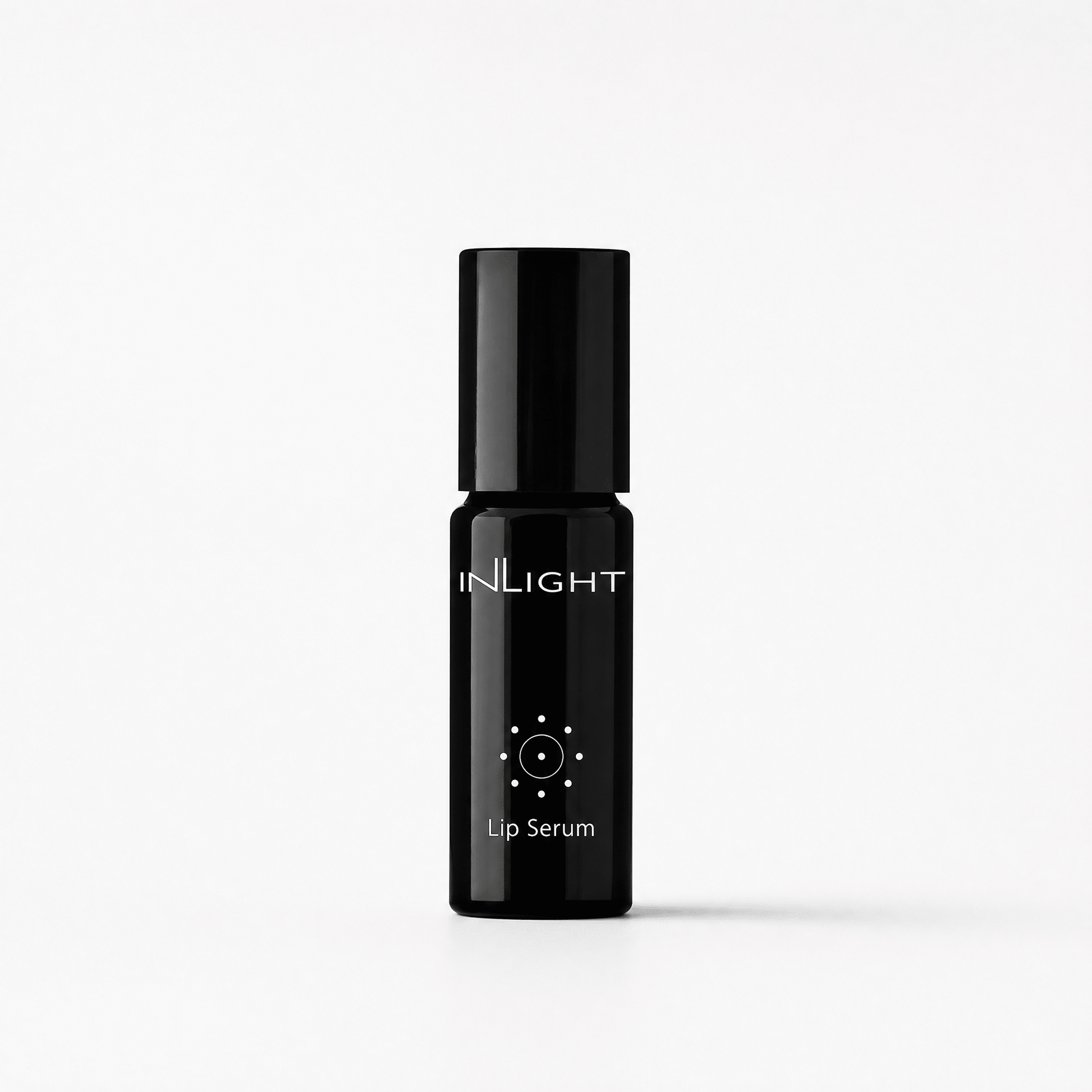 A black cylindrical lip serum bottle with a matching black cap, featuring the brand name 'INLIGHT' and 'Lip Serum' printed in white on the front, set against a clean white background.