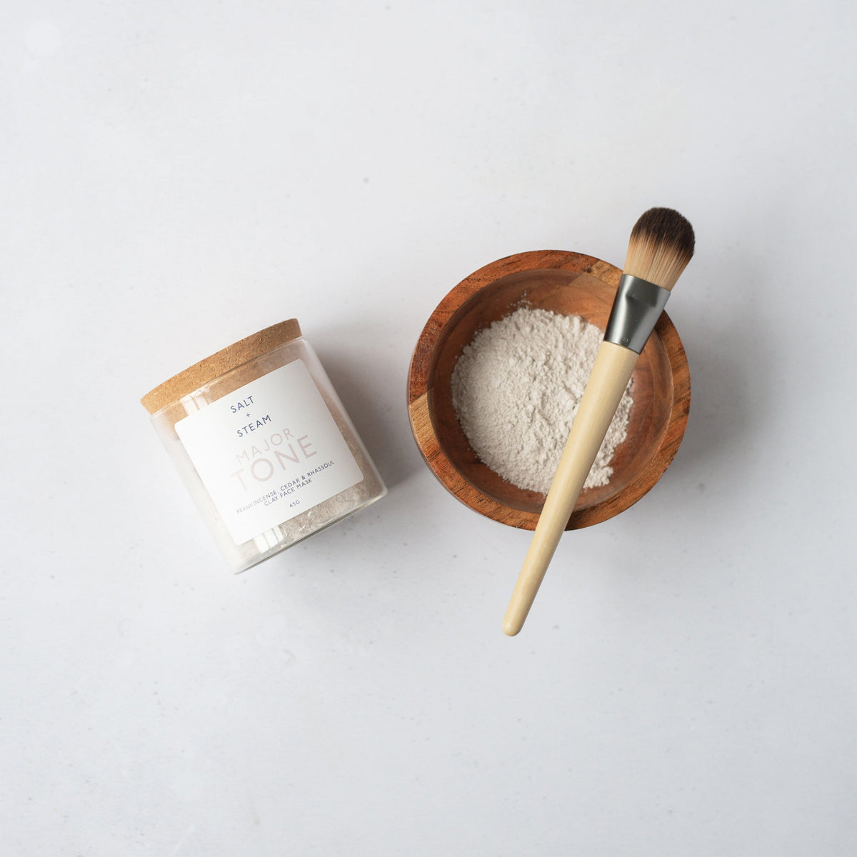Salt + Steam Major Tone clay face mask being applied