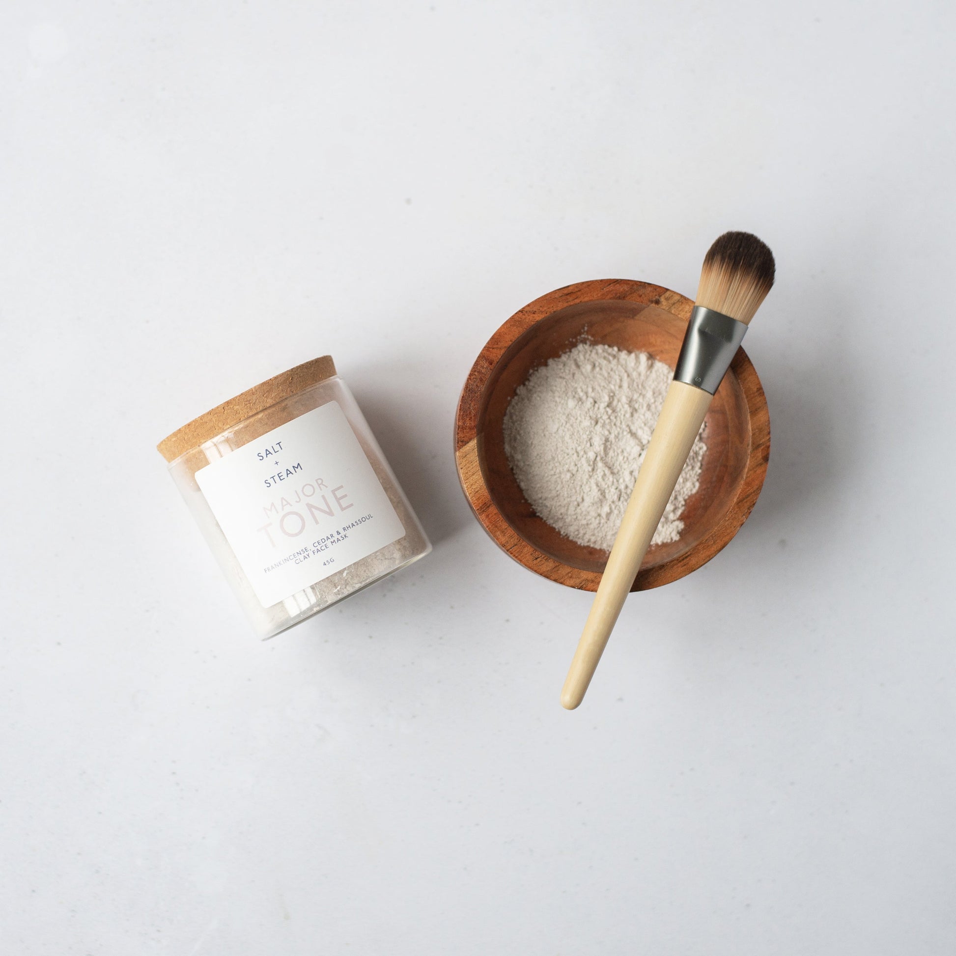 Salt + Steam Major Tone clay face mask being applied