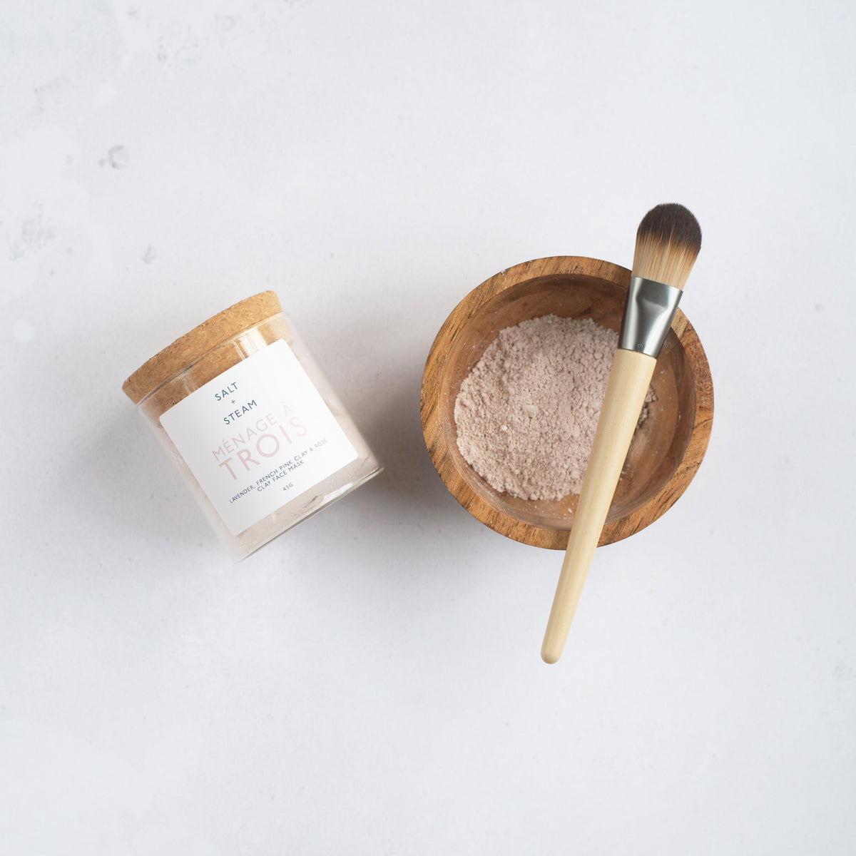 Salt + Steam Ménage à Trois clay face mask being applied