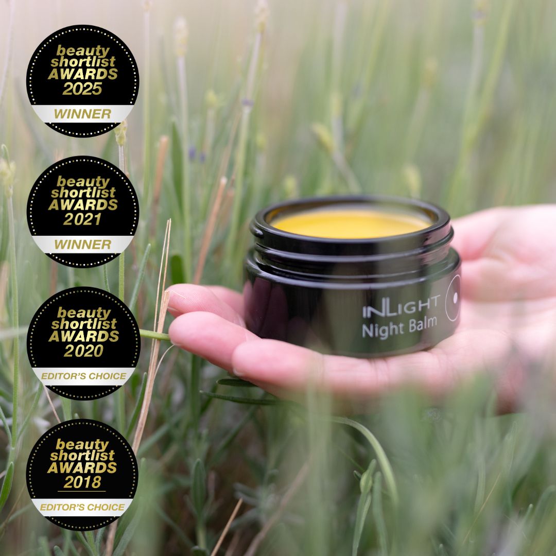 Hand holding a jar of Inlight Beauty Night Balm 45ml with awards displayed in the corner.