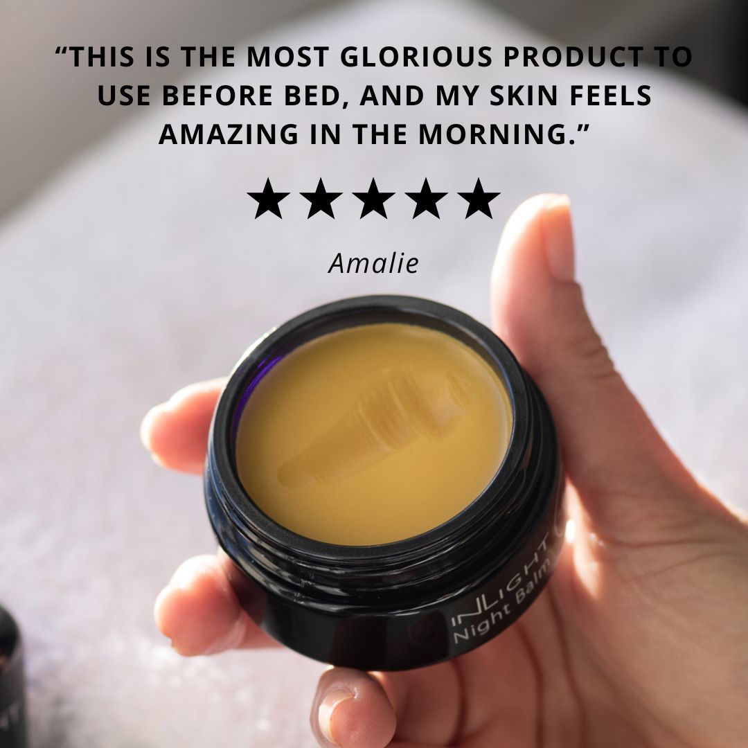 Hand holding a jar of Inlight Beauty Night Balm 45ml with customer review text above it