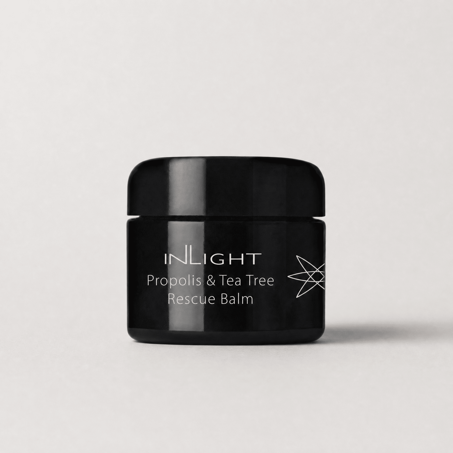 Inlight Beauty Propolis & Tea Tree Rescue Balm 28ml on a light grey background