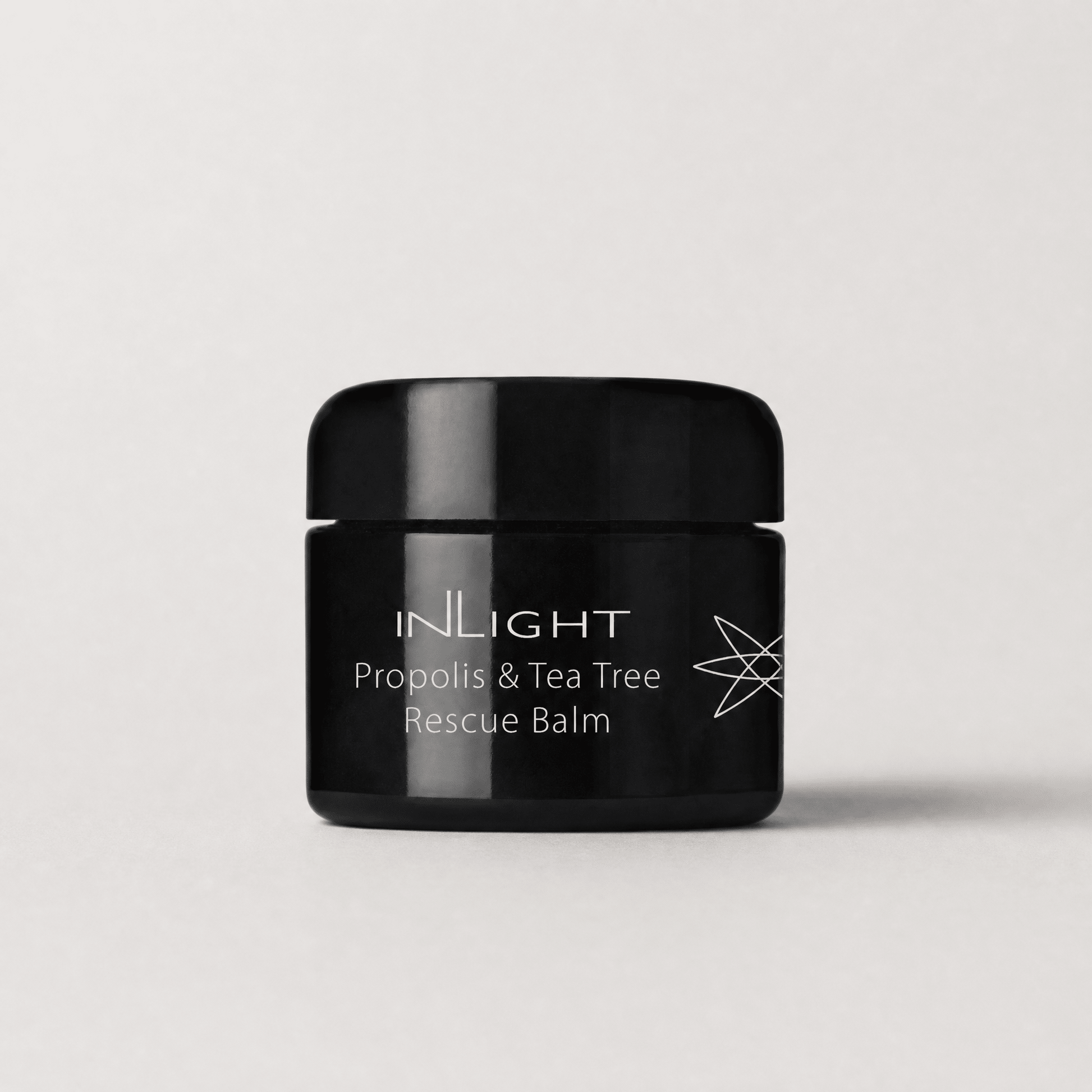 Inlight Beauty Propolis & Tea Tree Rescue Balm 28ml on a light grey background