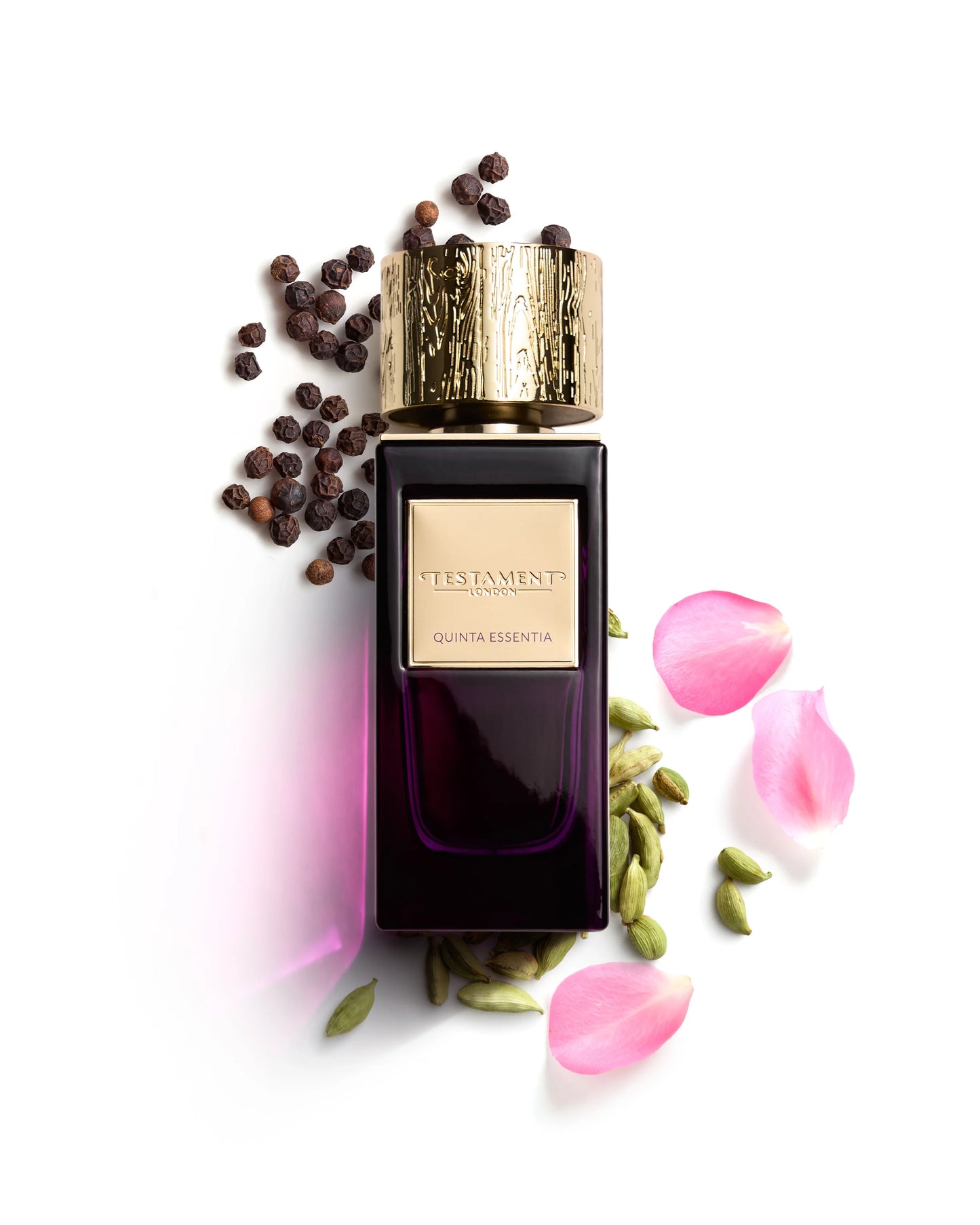 Perfume bottle with rose petals and spices on a white background