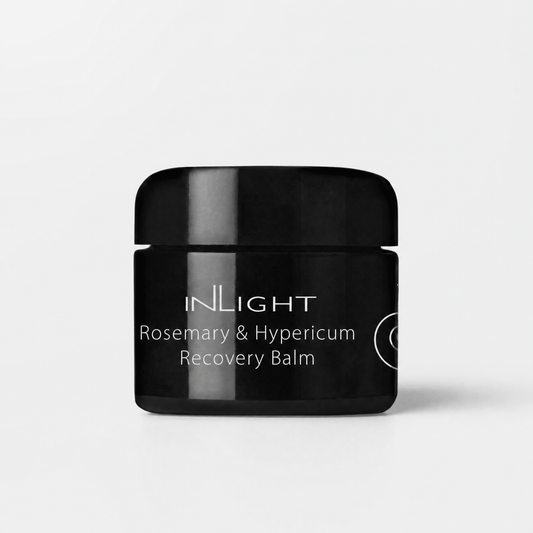Black jar of Inlight Beauty Rosemary & Hypericum Recovery Balm 45ml on a light grey background