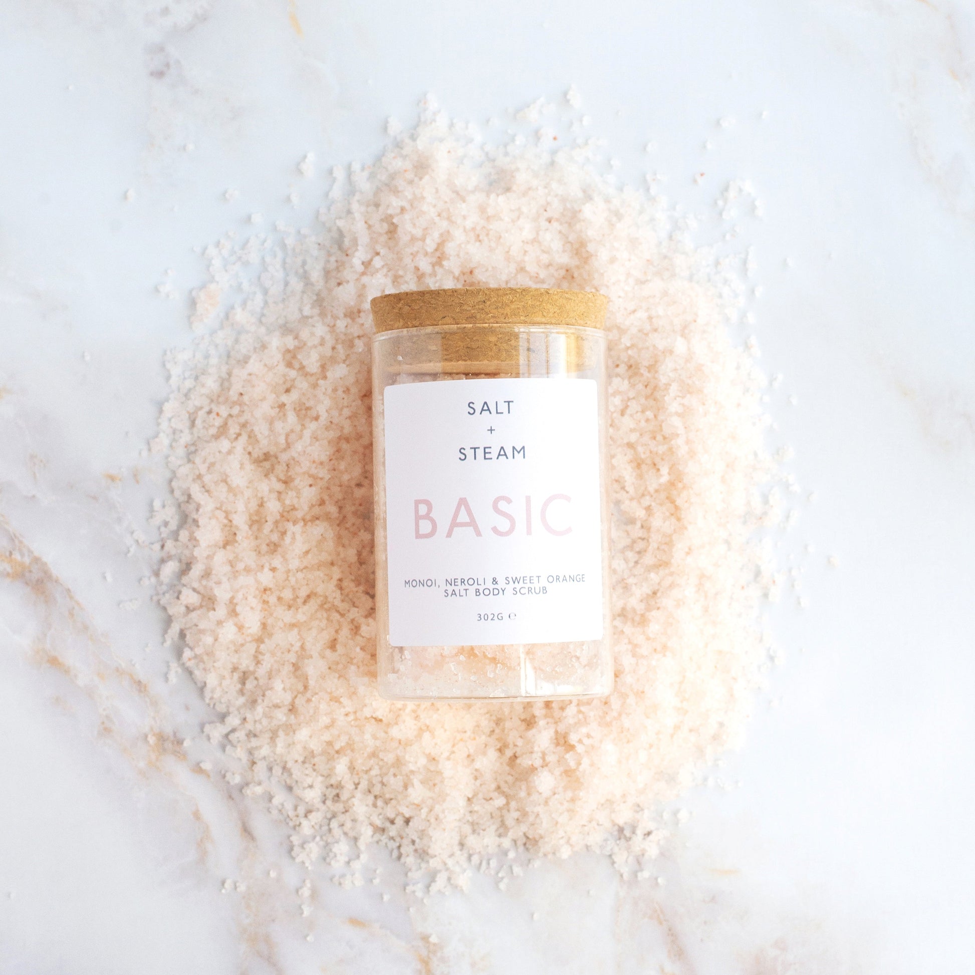 Salt + Steam Basic body scrub being applied to skin