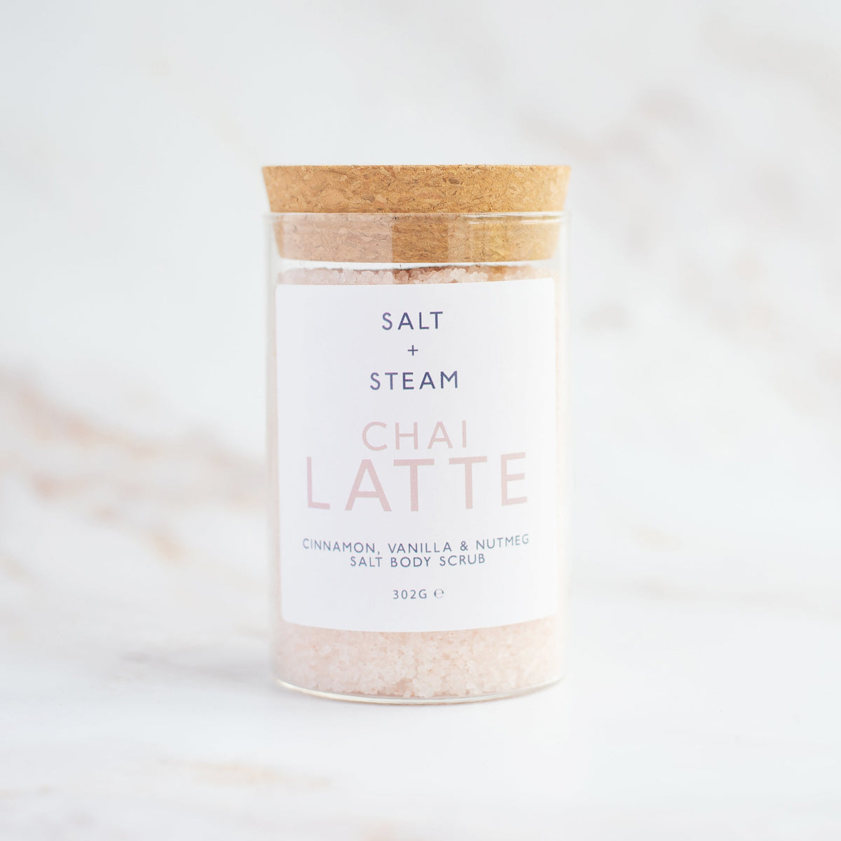 Salt + Steam Chai Latte body scrub being applied to skin