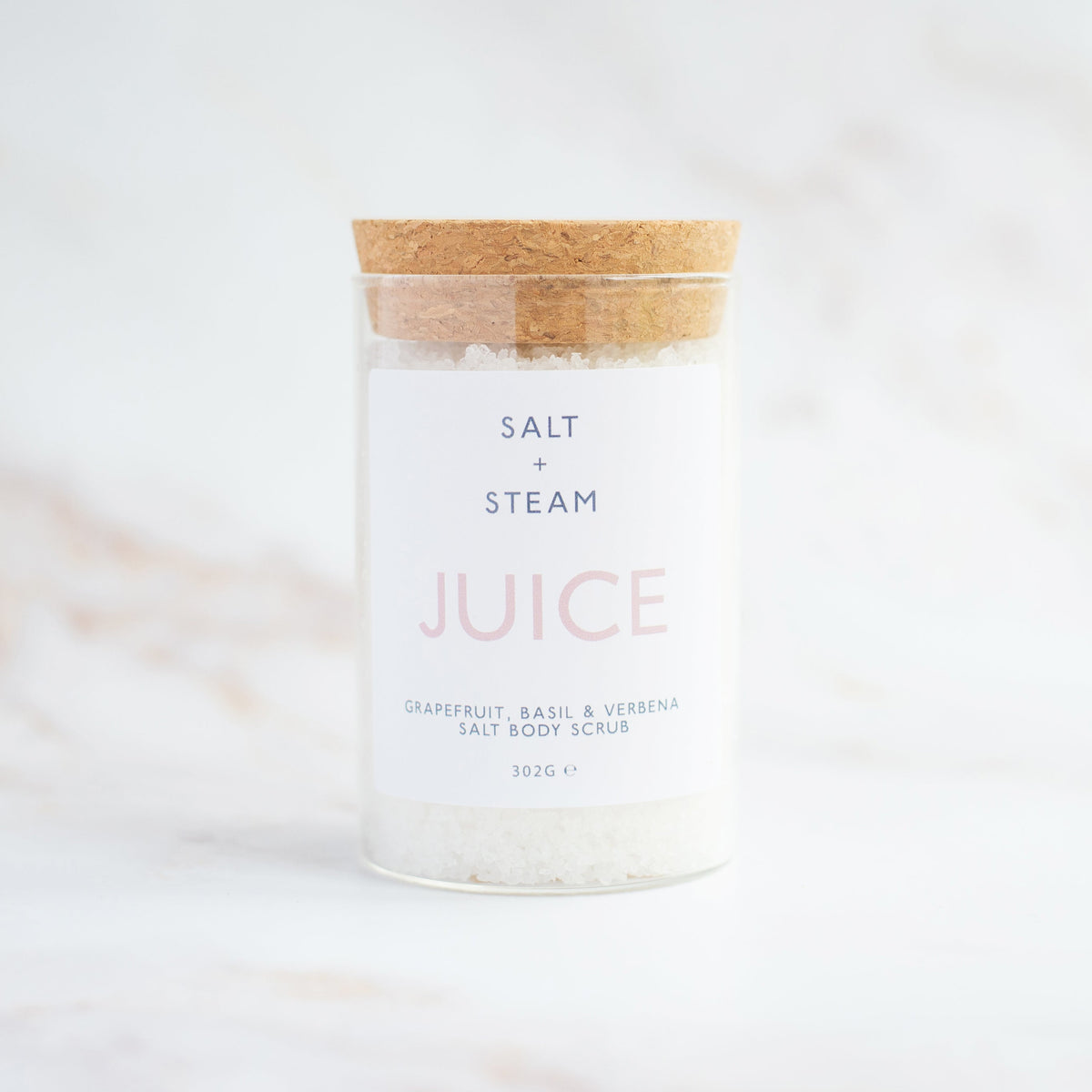 Salt + Steam Juice body scrub being applied to skin