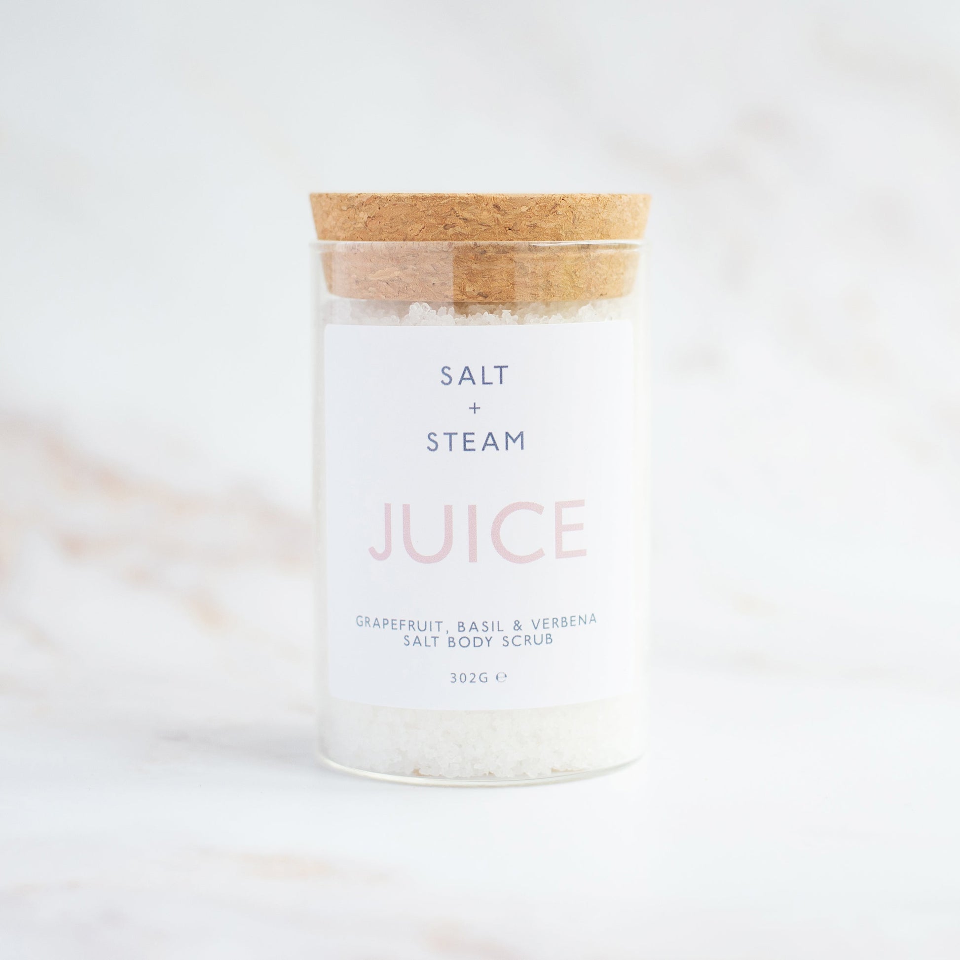 Salt + Steam Juice body scrub being applied to skin